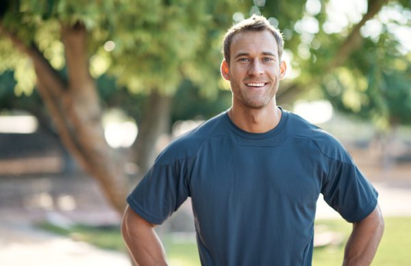 Cropped portrait of a male athlete standing in the parkhttp://195.154.178.81/DATA/i_collage/pu/shoots/805414.jpg